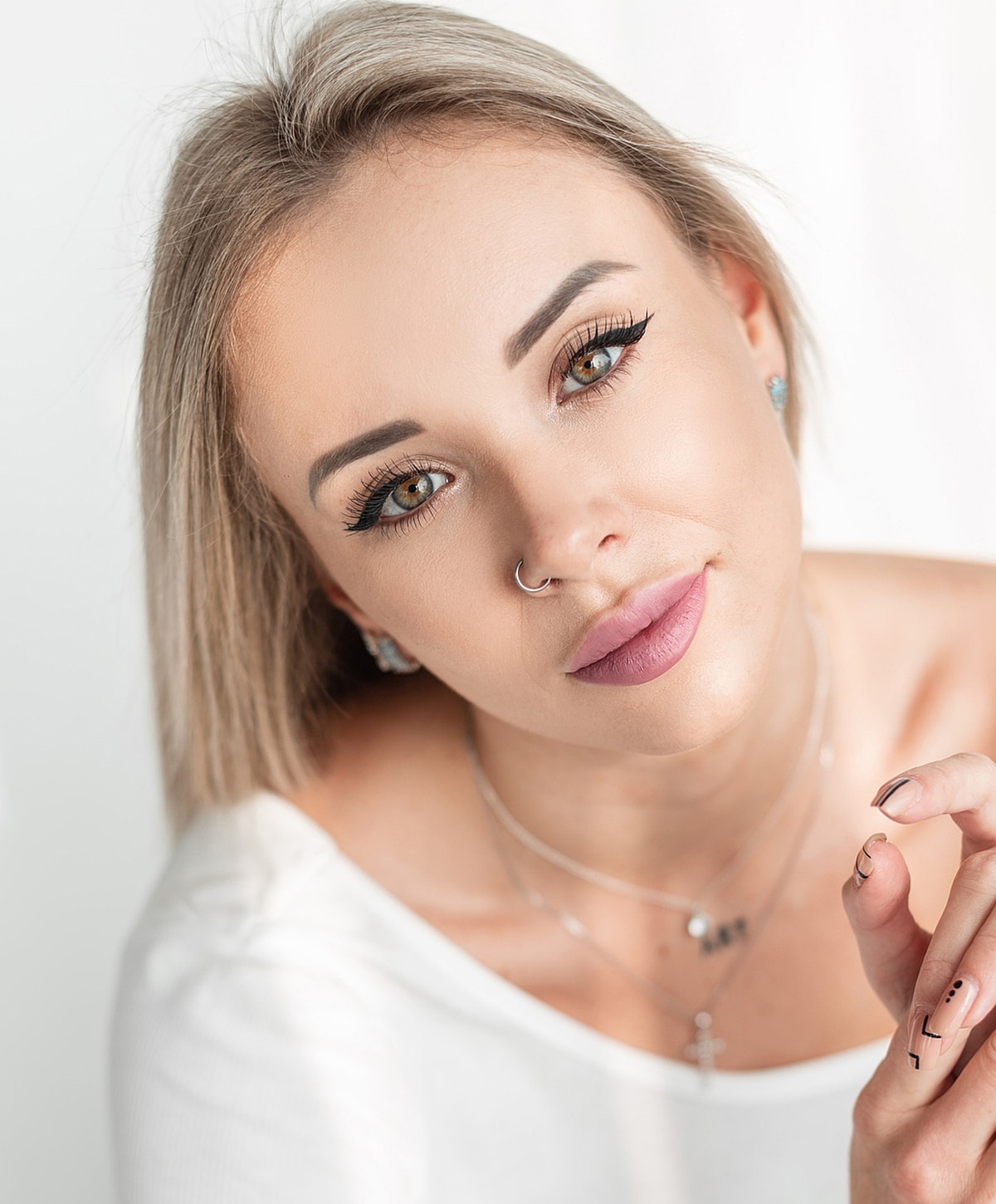 Close-up portrait of a woman with blonde hair.