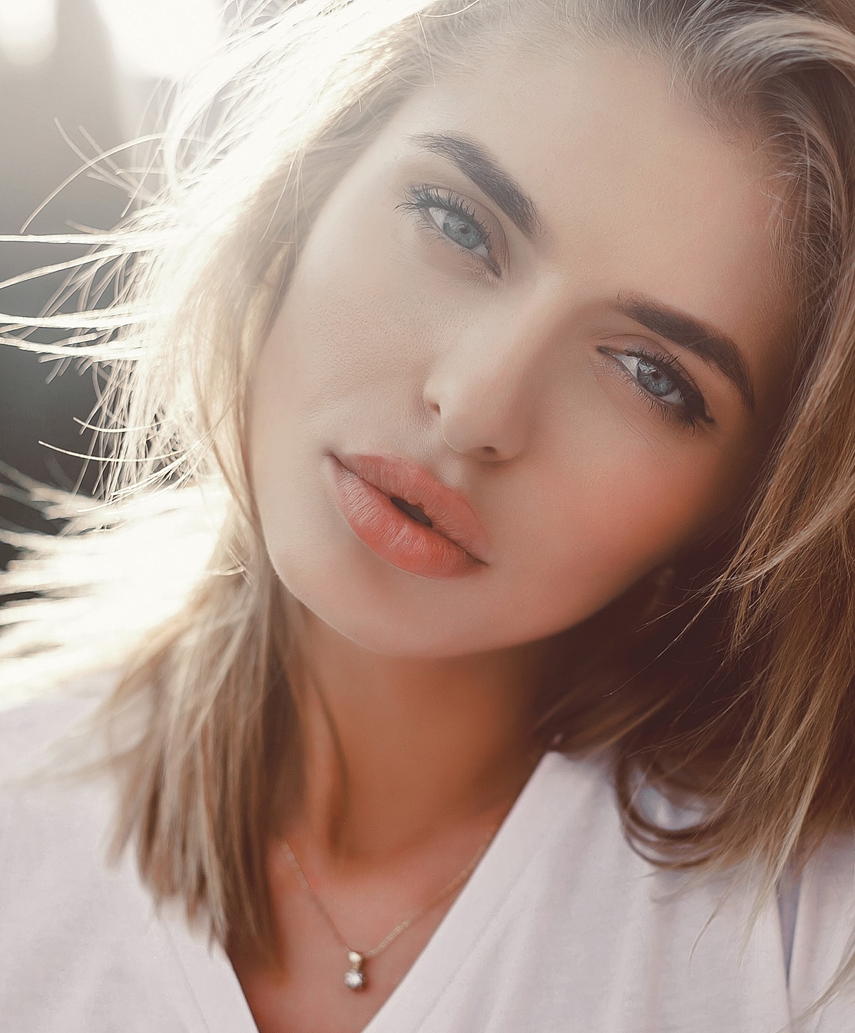 Close-up portrait of a woman with light hair.