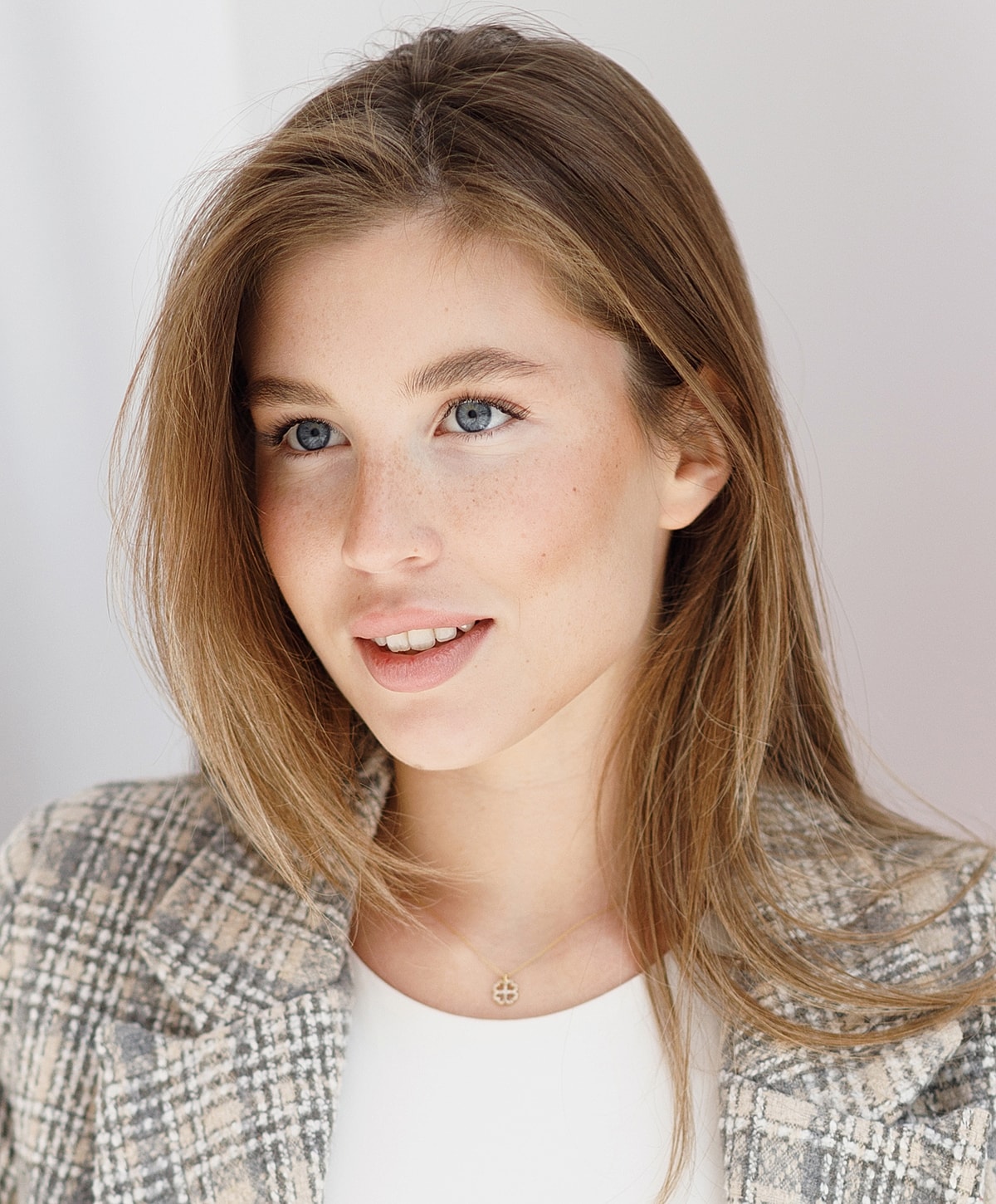 Portrait of a young woman with long hair.
